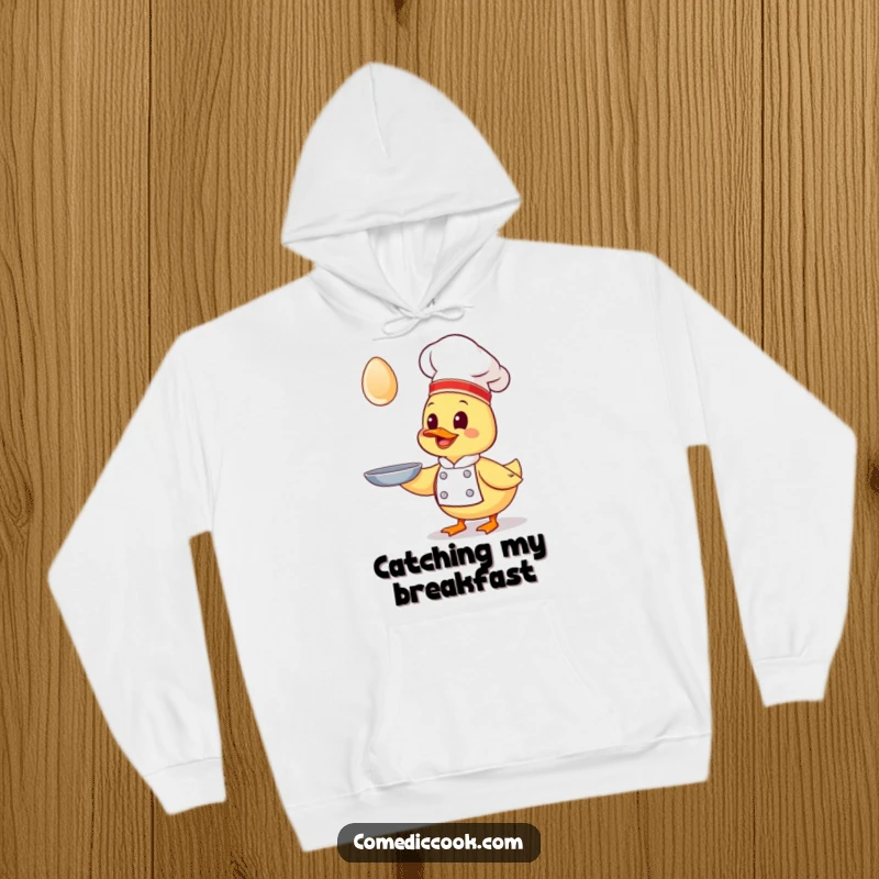 Funny Kawaii duck chef hoodie, a giggling duck chef chasing a flying egg, soft and warm, perfect comical gift.