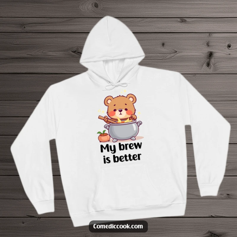 Funny Bear Cub Chef Hoodie showing a smiling bear cub tending to a steaming soup cauldron, embodying comfort.