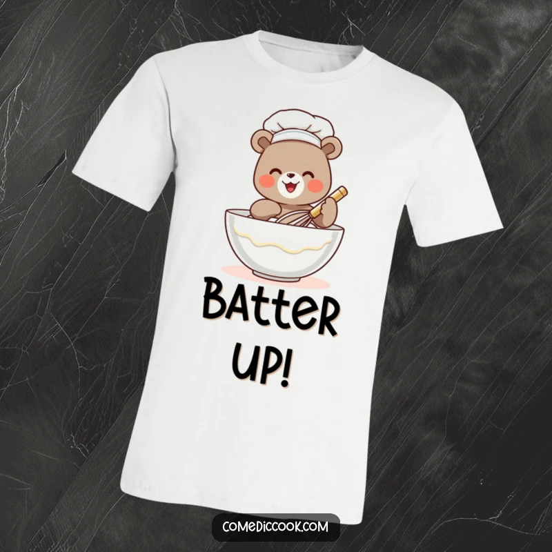Funny bear chef t-shirt with a tiny bear gleefully whisking batter, ideal for food lovers and anyone seeking humorous apparel.