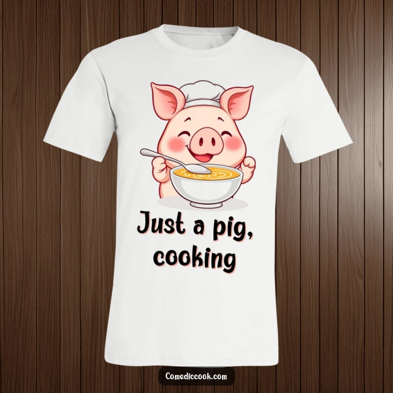 Funny Pig Chef T-Shirt: A smiling pig chef happily tastes soup with a tiny spoon, a culinary comedy masterpiece.