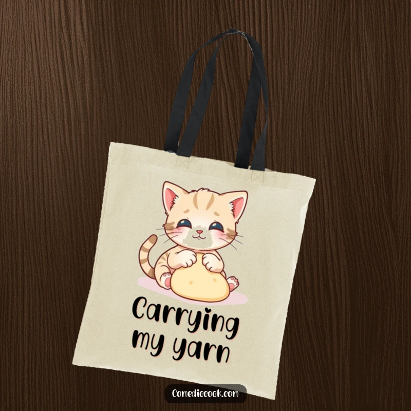 Funny kitten tote bag showcasing a playful kitten gracefully kneading dough with tiny paws, great for shopping.
